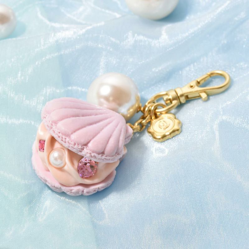 PUFFYコラボ Q-potマカロンキーホルダー Q-pot. マカロンキーホルダー VANPS - メルカリ